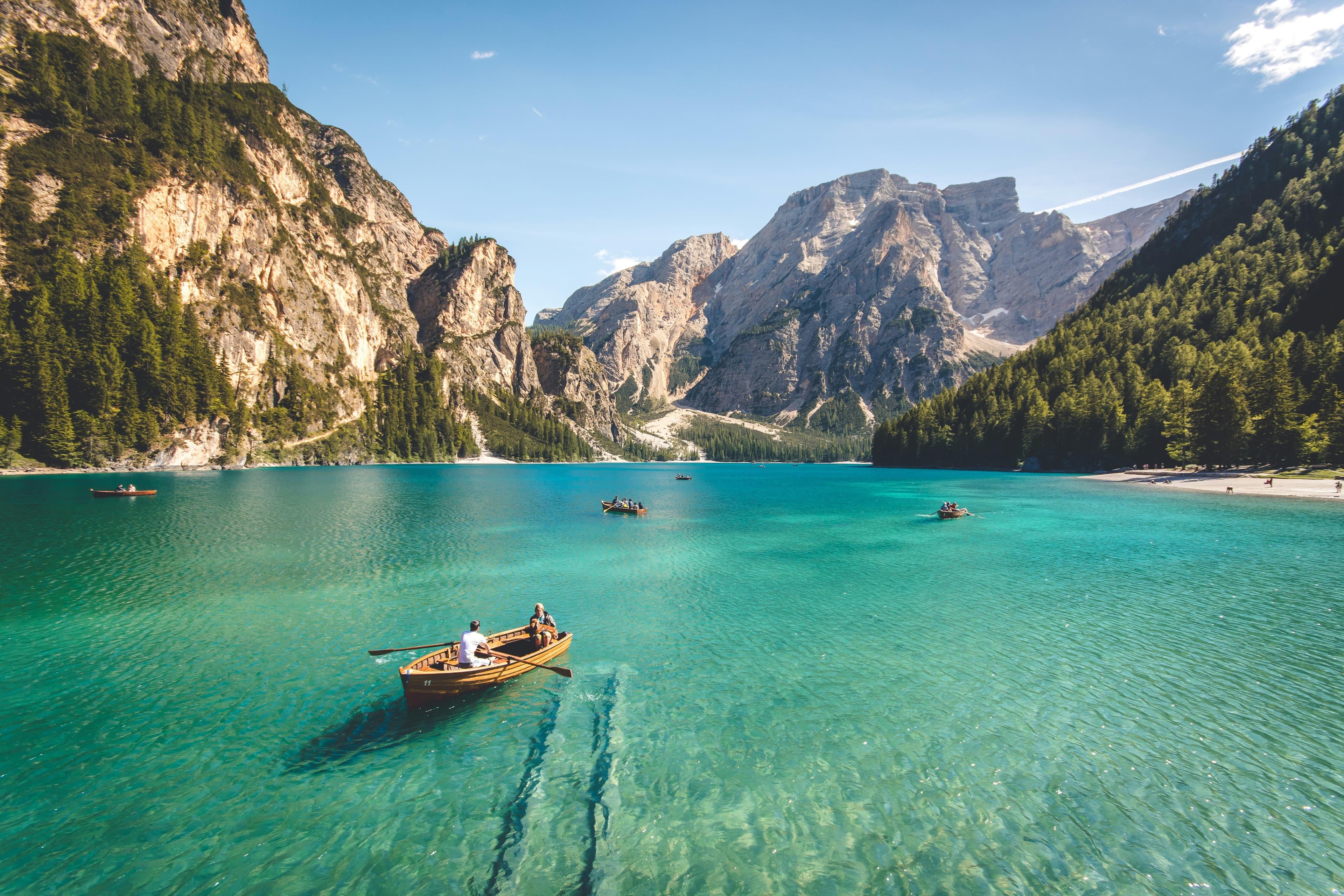 An image of boats passing through a fjord